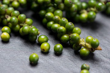 Fresh green pepper on dark background.