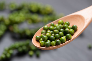 Fresh green pepper on dark background.