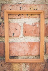 Brick wall texture background with picture frame. Macro shot.