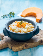 rice with pumpkin in a clay bowl