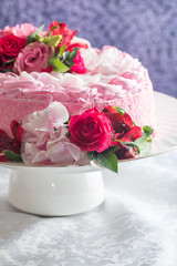 Pink cake with natural beautiful flowers