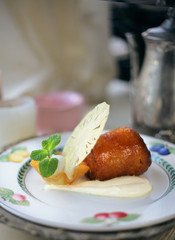 dessert with the rum baba, pine apple, ice cream in the tartlet and mint