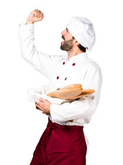 Lucky young baker holding some bread