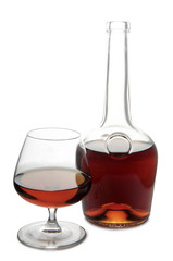 Glass with brandy and whiskey on white background