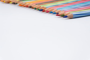 Colored pencils white background. Selective focus