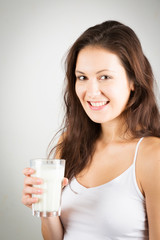 Young Woman Enjoying A Glass Of Milk