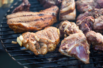 Cooking grilled red meat on barbeque