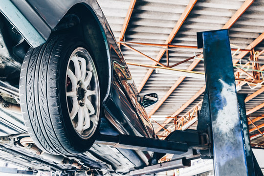 Car On Lift In Car Repair Station