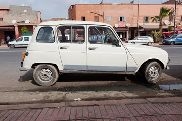 Old, from sixties, French minivan parks at street of Marrakesh