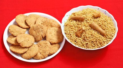 Indian Mathari made with fine wheat flour and namkeen Bikaneri Bhujiya  made with chickpea flour (Besan), popular Indian snacks