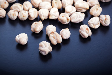 Dry chickpeas on dark background
