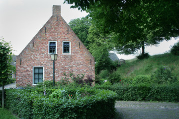 Fototapeta na wymiar Old houses in the forrtess village of Bourtange