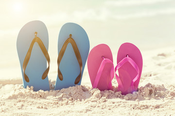 Color slippers on beach