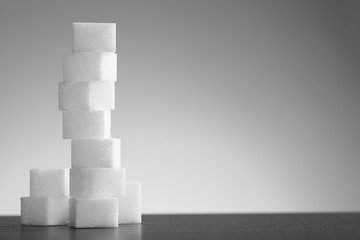 Pile of lump sugar on white background
