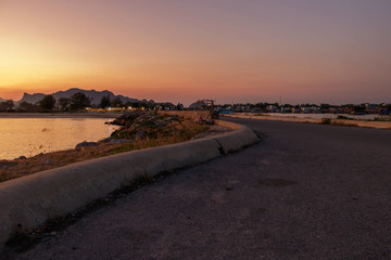 The path to the sea and mountain view at sunset.