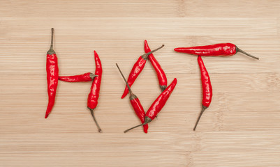 Hot Text Made Of Red Chili Peppers On Table