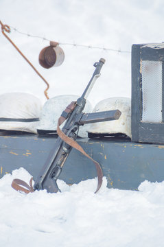 winter on the box are German helmets and machine during the second world war.
