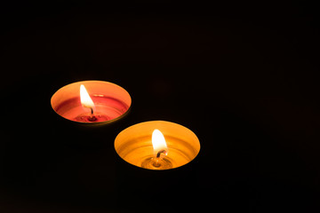 two candles in the dark