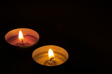 two candles in the dark
