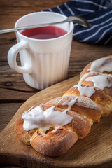 Sweet bun on a cutting board.