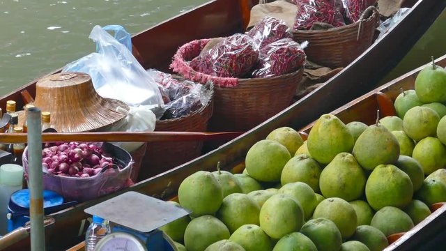 Boat with fruits and vegetables on floating market Damnoen Saduak in Bangkok, Thailand
