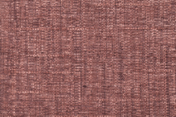 Brown fluffy background of soft, fleecy cloth. Texture of textile closeup