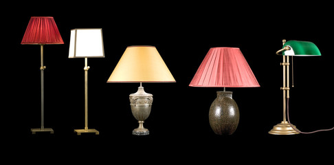Five Decorative table lamps isolated on black background