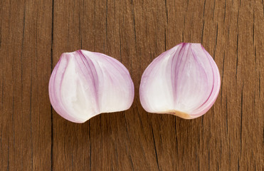 close up slices of shallots on table wood background.