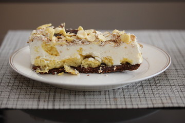 A piece of cake on the plate. Homemade rustic tart with muesli.
