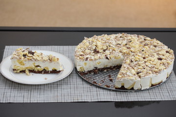 A piece of cake on the plate. Homemade rustic tart with muesli.
