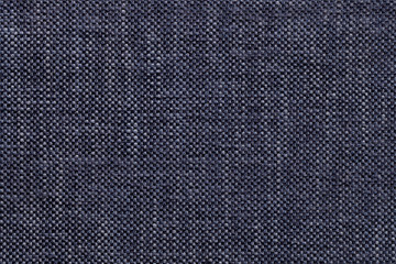 Denim textile background with checkered pattern, closeup. Structure of the fabric macro.