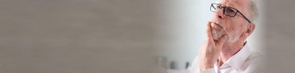 Fototapeta premium Portrait of thoughtful senior businessman