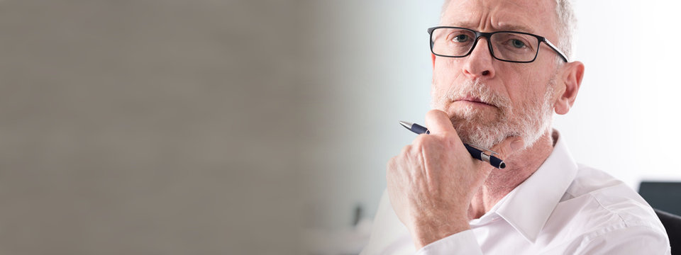 Portrait Of Thoughtful Senior Businessman