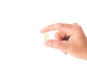 Hand holding fish oil medicine with white background