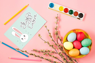 The top view of easter on pink table office workplace