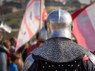 Back view of medieval knight on recreation event