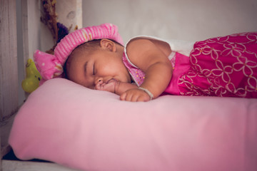 portrait of baby sleep and sucking finger.