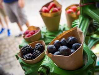 Fresh red fruit on a green stand