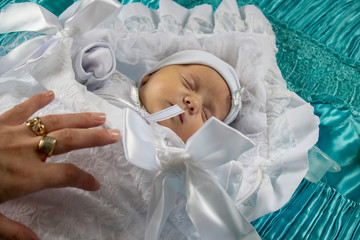 Fototapeta premium baby wrapped in a white sheet