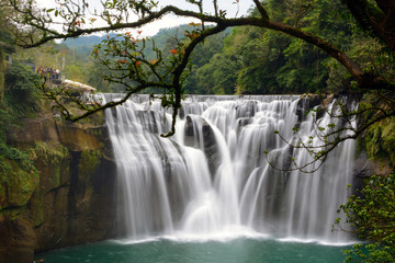 Fototapeta na wymiar Smooth long exposure of Taiwan's beautiful Shifen Falls in Pingxi District