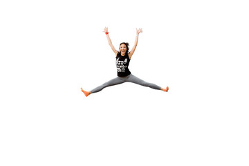 Attractive excited fitness girl in sportwear jumping trampoline isolated on white background