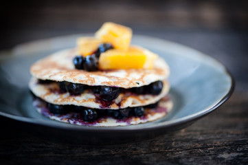 Small crepes cake with blueberries