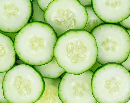 Fresh cucumber slices background.