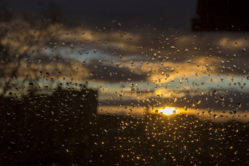 Sunset City Through Rainy Window