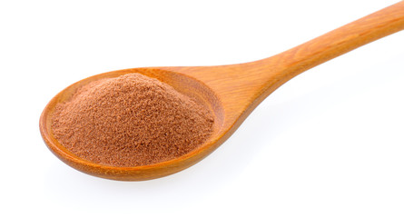 malt extract in wood spoon on white background