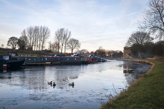 A winter image of Narrowboats moored at Barnoldswick marina on the Leeds and Liverpool canal in Lancashire.