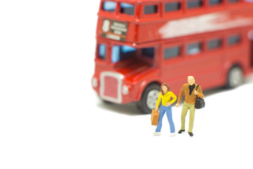 Miniature people couple on travel isolated on white background