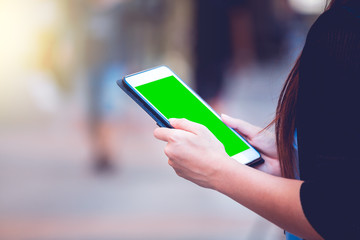 Closeup of asia women hand using tablet in economic zones