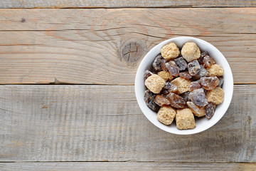 Brown sugar in bowl on table top view