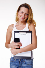 Smiling woman with clipbord and mobile phone